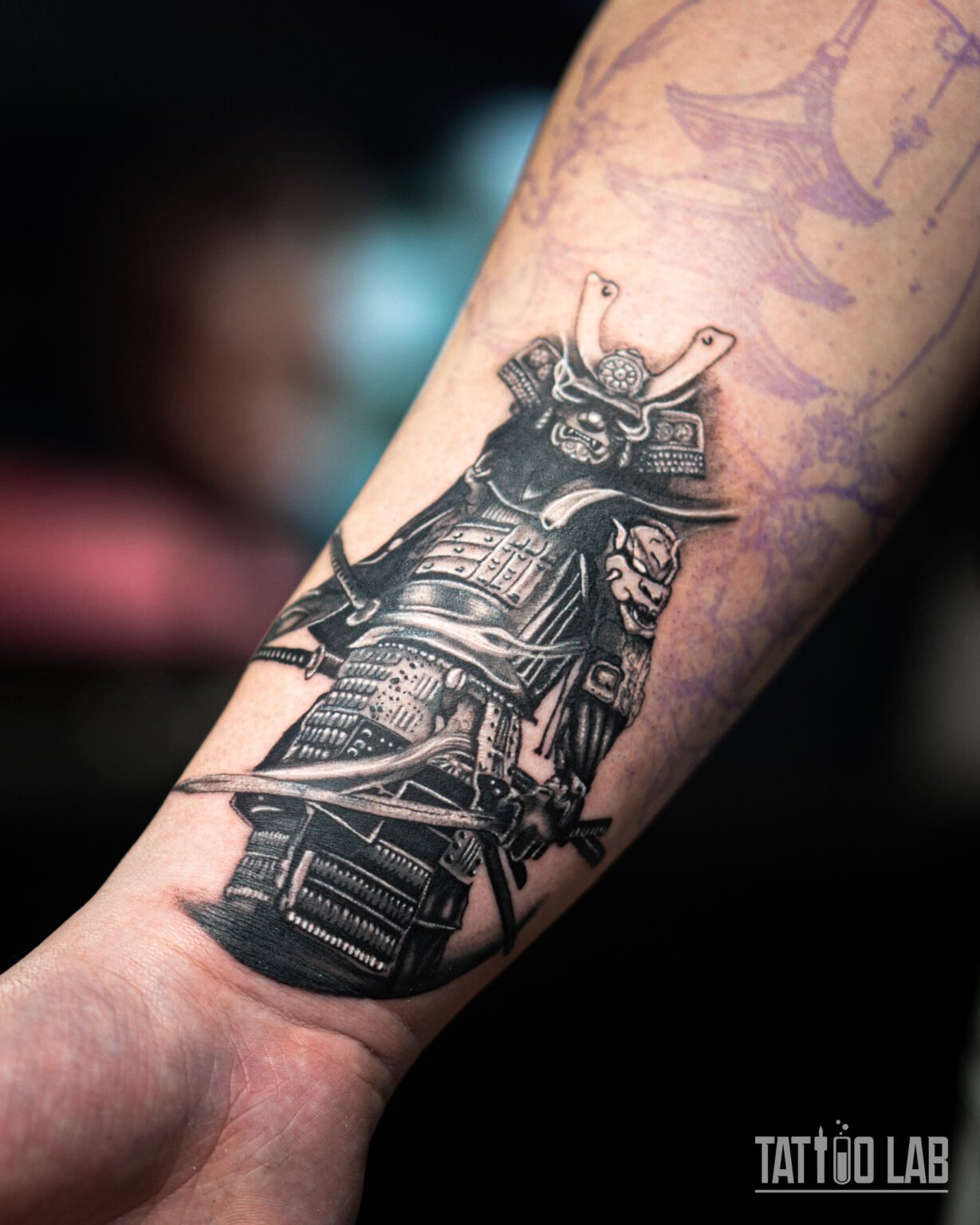 Black and grey realism samurai tattoo in full armour holding a katana on the forearm, Tattoo Lab, Halifax