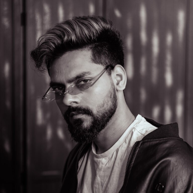 Professional portrait of Vivek, lead tattoo artist and founder of Tattoo Lab Studios Halifax, specializing in black and grey realism and fine line tattoos.