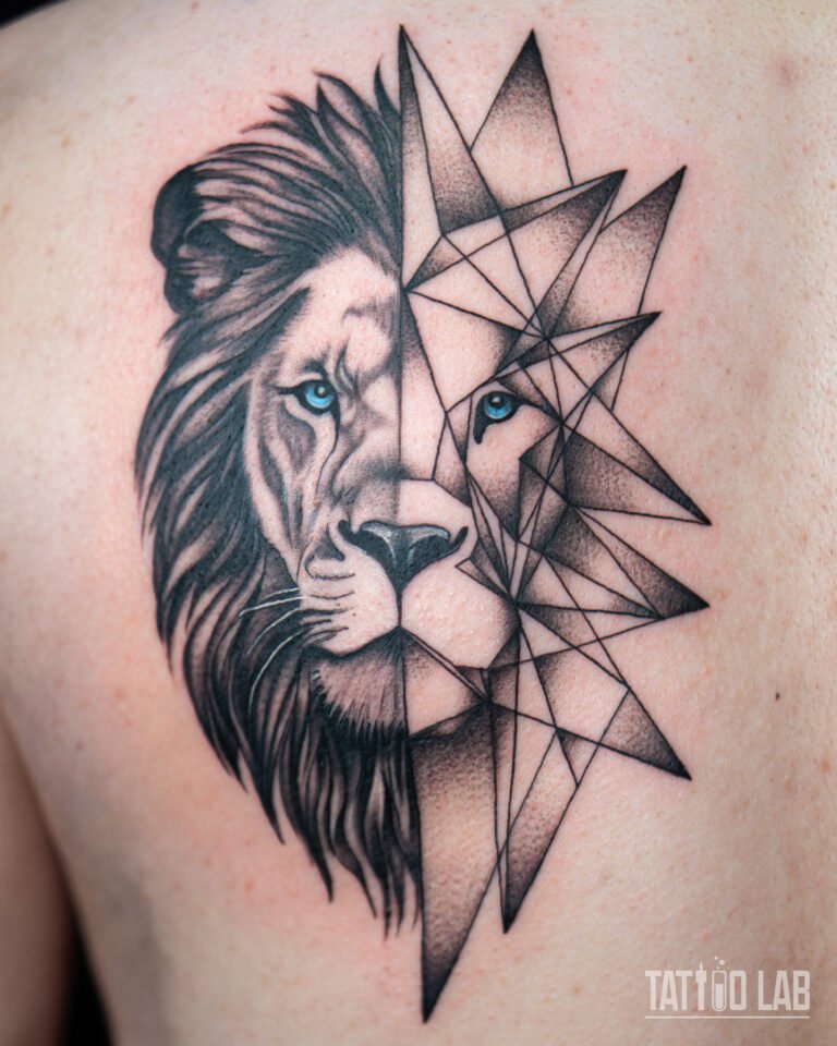Close-up of a half realism, half geometric lion tattoo with blue eyes and dotwork shading