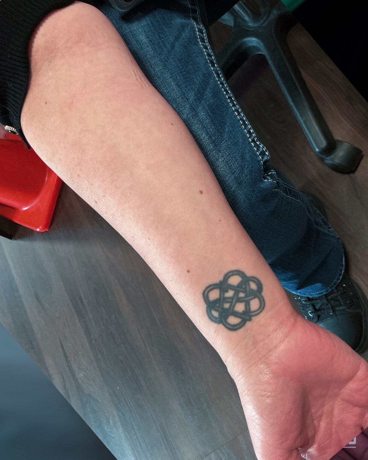 Small black Celtic knot tattoo on the inner forearm, before its cover-up at Tattoo Lab, Halifax